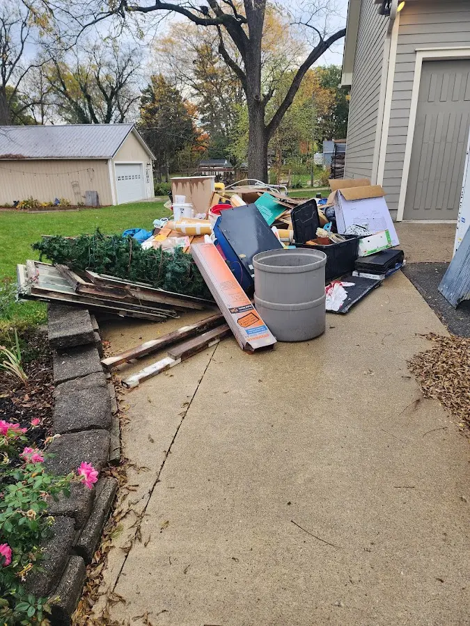 Dumpster being loaded with debris for Residential Dumpster Rental in Hilmar-Irwin